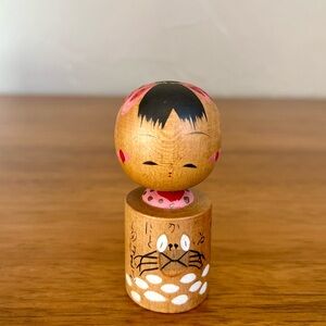 Wooden Kokeshi Doll with Pink Accents & Crab